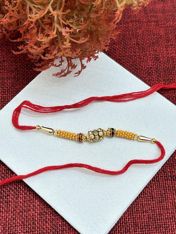 Golden Red AD Stone Pearl Rakhi For Brother